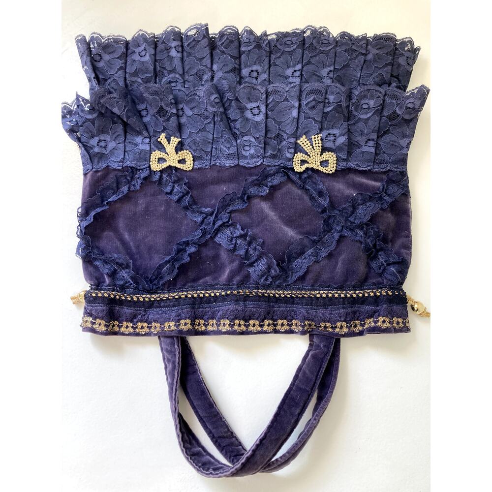 Unique purple lace purse with gold bow accents